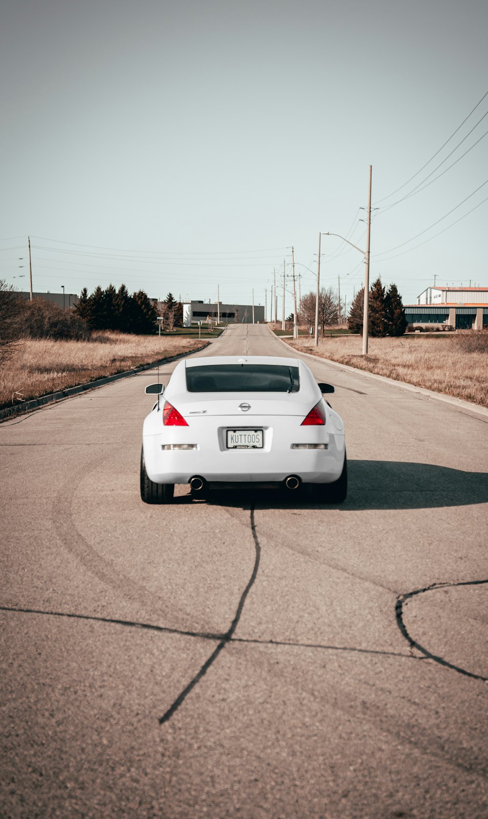 white car on road during daytime