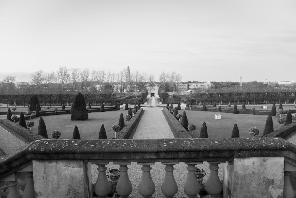 grayscale photo of concrete fence