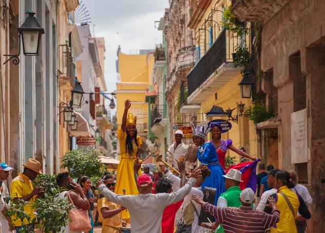 people in traditional dress walking on street during daytime