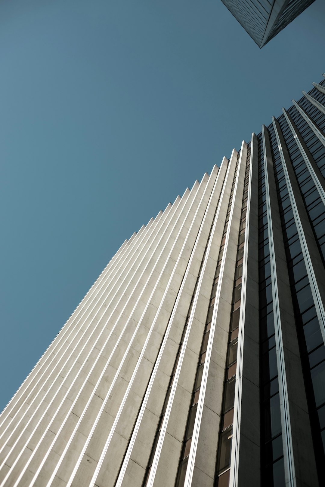 white concrete building under blue sky during daytime