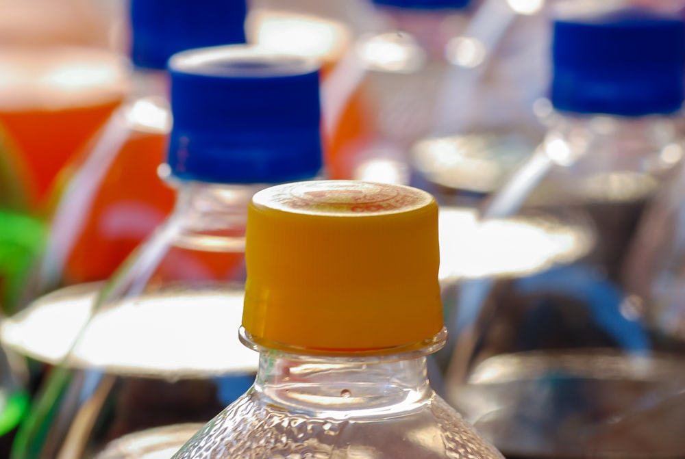 clear plastic bottle with yellow cap