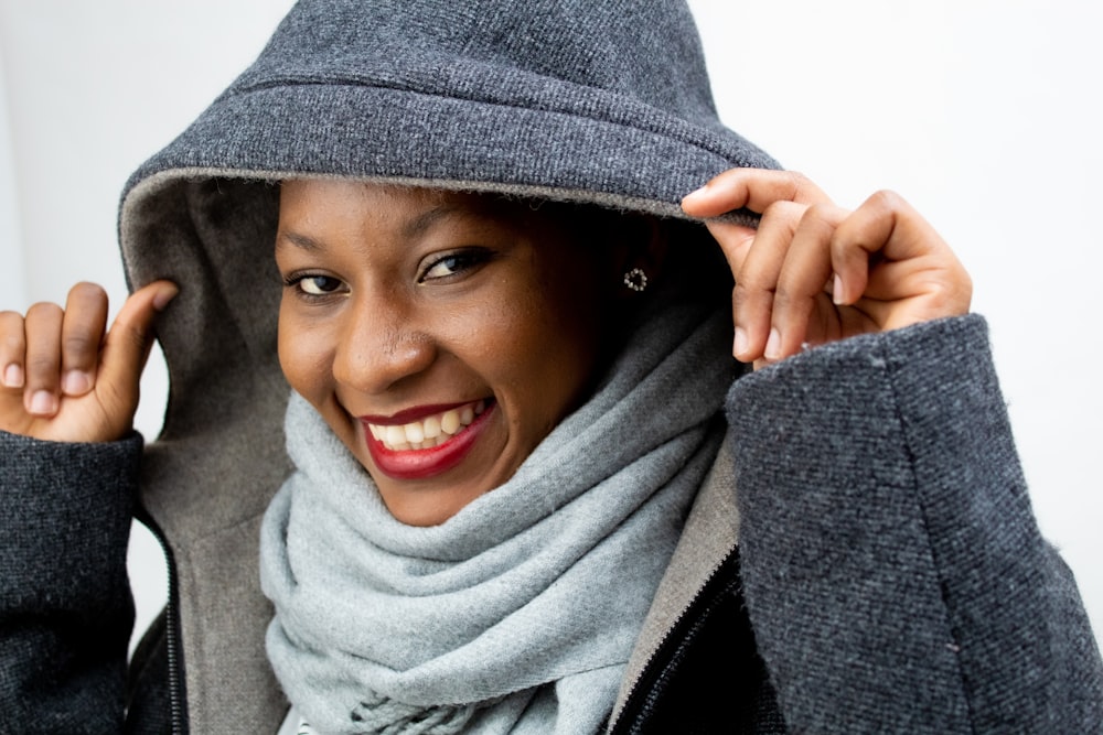 woman in gray scarf smiling