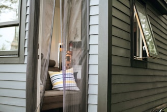 white and brown wooden framed glass door