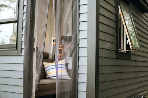 white and brown wooden framed glass door