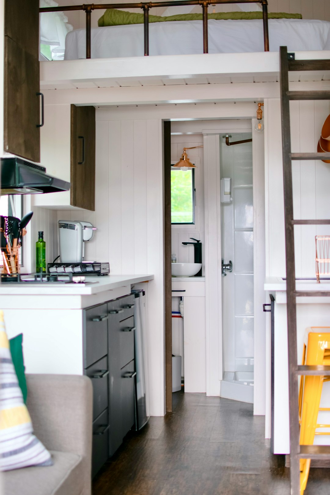 white top mount refrigerator beside white wooden kitchen cabinet
