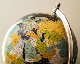 Global Visa Consultancy – blue and yellow globe symbolizing connecting people worldwide
