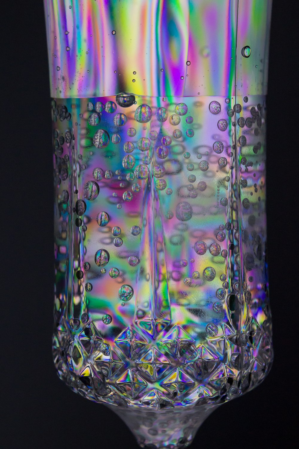 clear glass jar with green and purple liquid