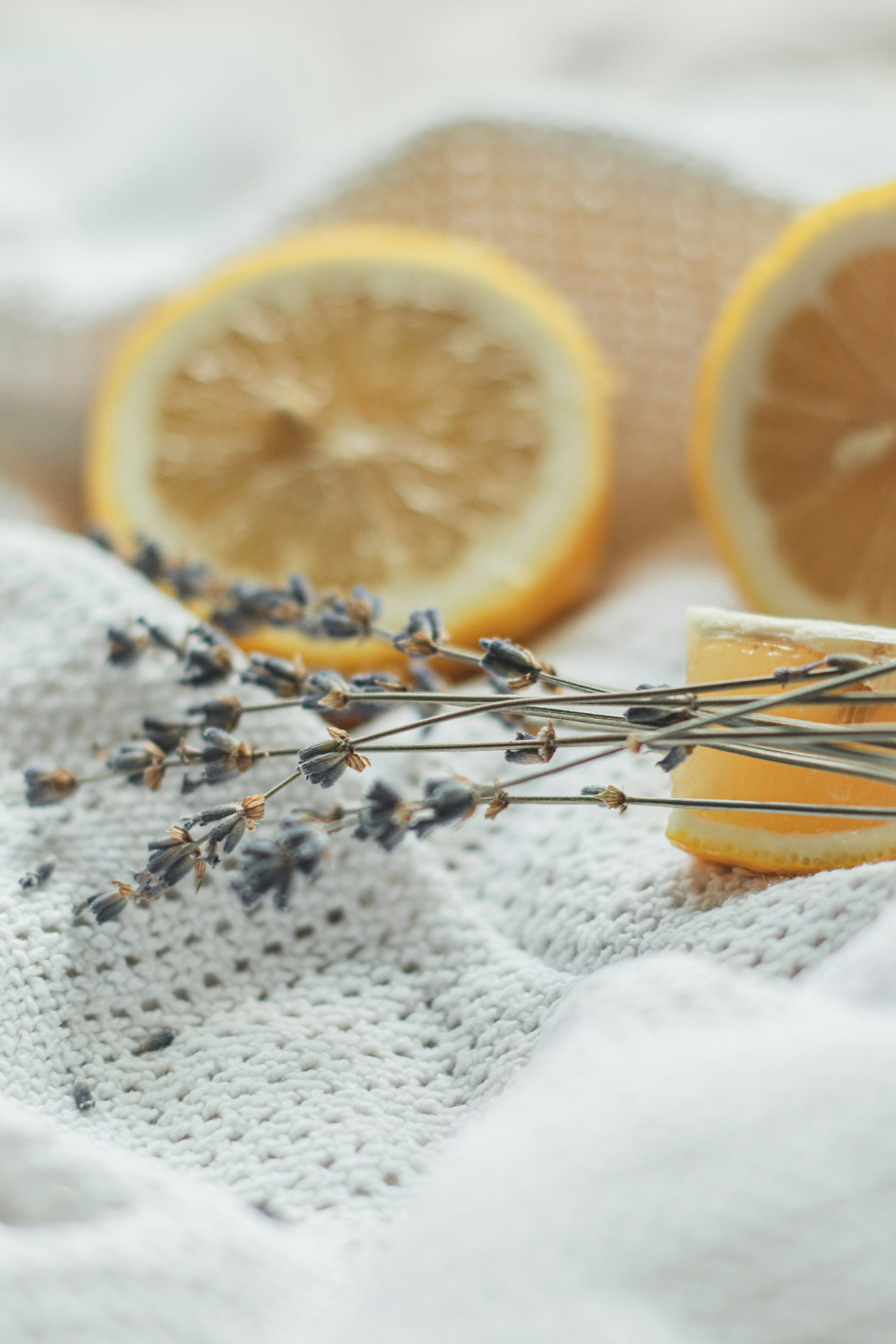 sliced orange fruit on white textile