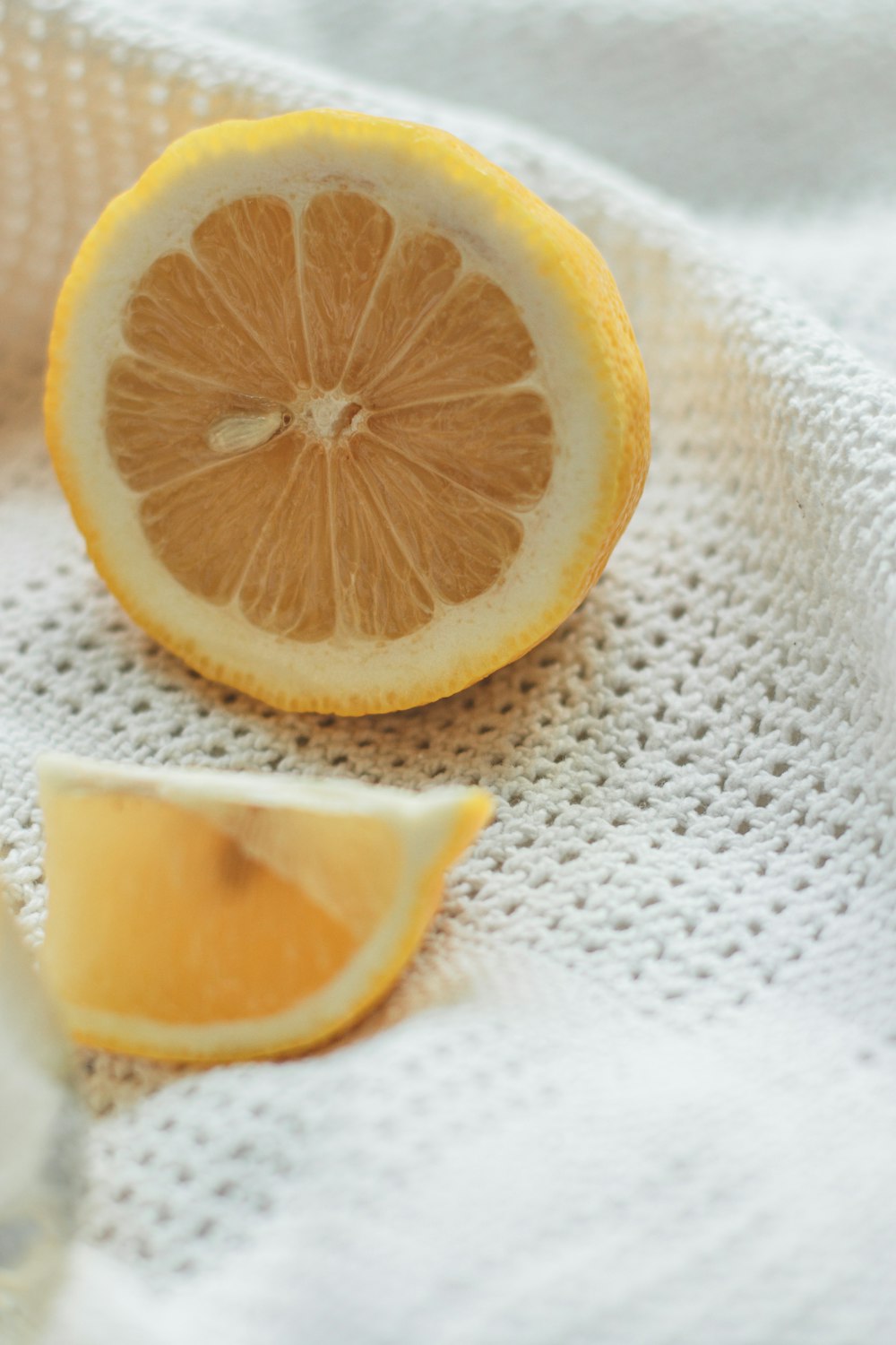 sliced lemon on white textile