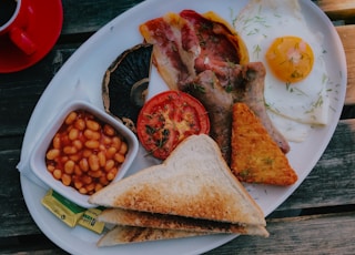 sliced meat with egg on white ceramic plate