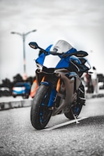 orange and black sports bike on road during daytime