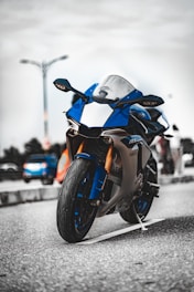 orange and black sports bike on road during daytime