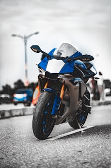 orange and black sports bike on road during daytime