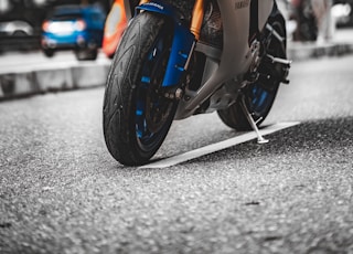 orange and black sports bike on road during daytime