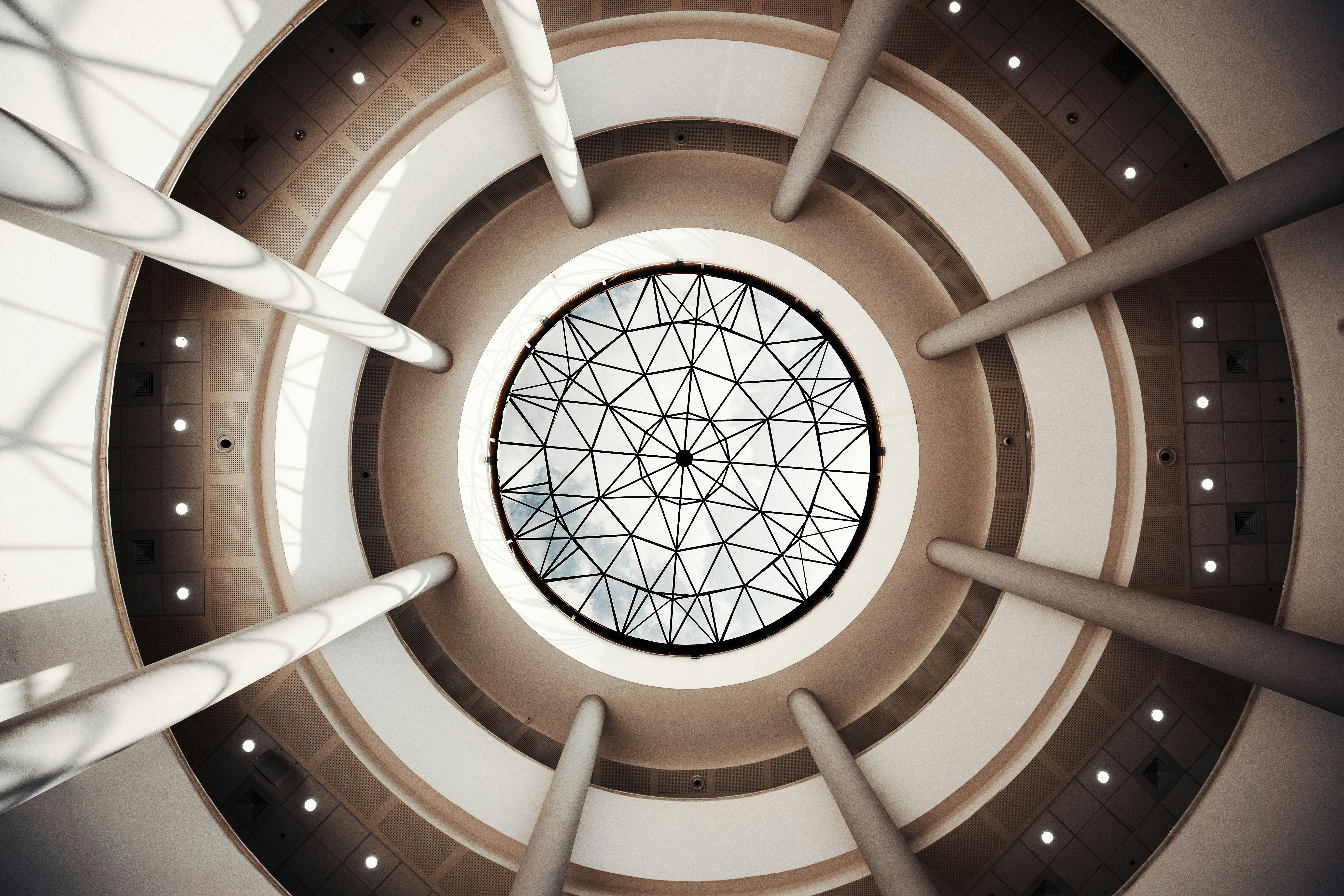 white and brown concrete building archi-texture teams background