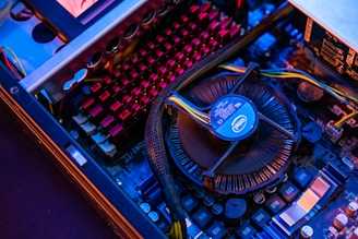 blue and black typewriter on brown wooden table