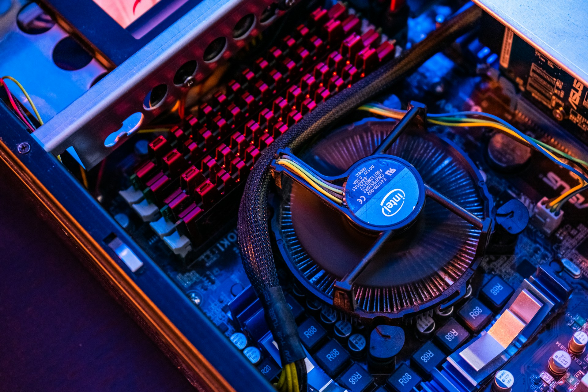 blue and black typewriter on brown wooden table