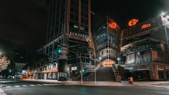 brown concrete building during nighttime in Santo Domingo Dominican Republic