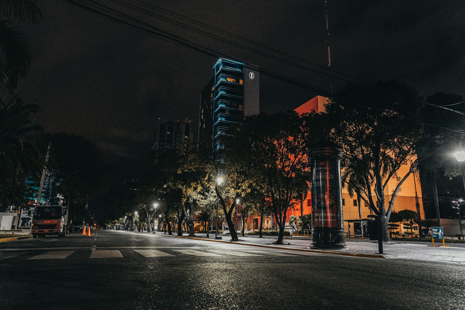lighted street light near building during night time