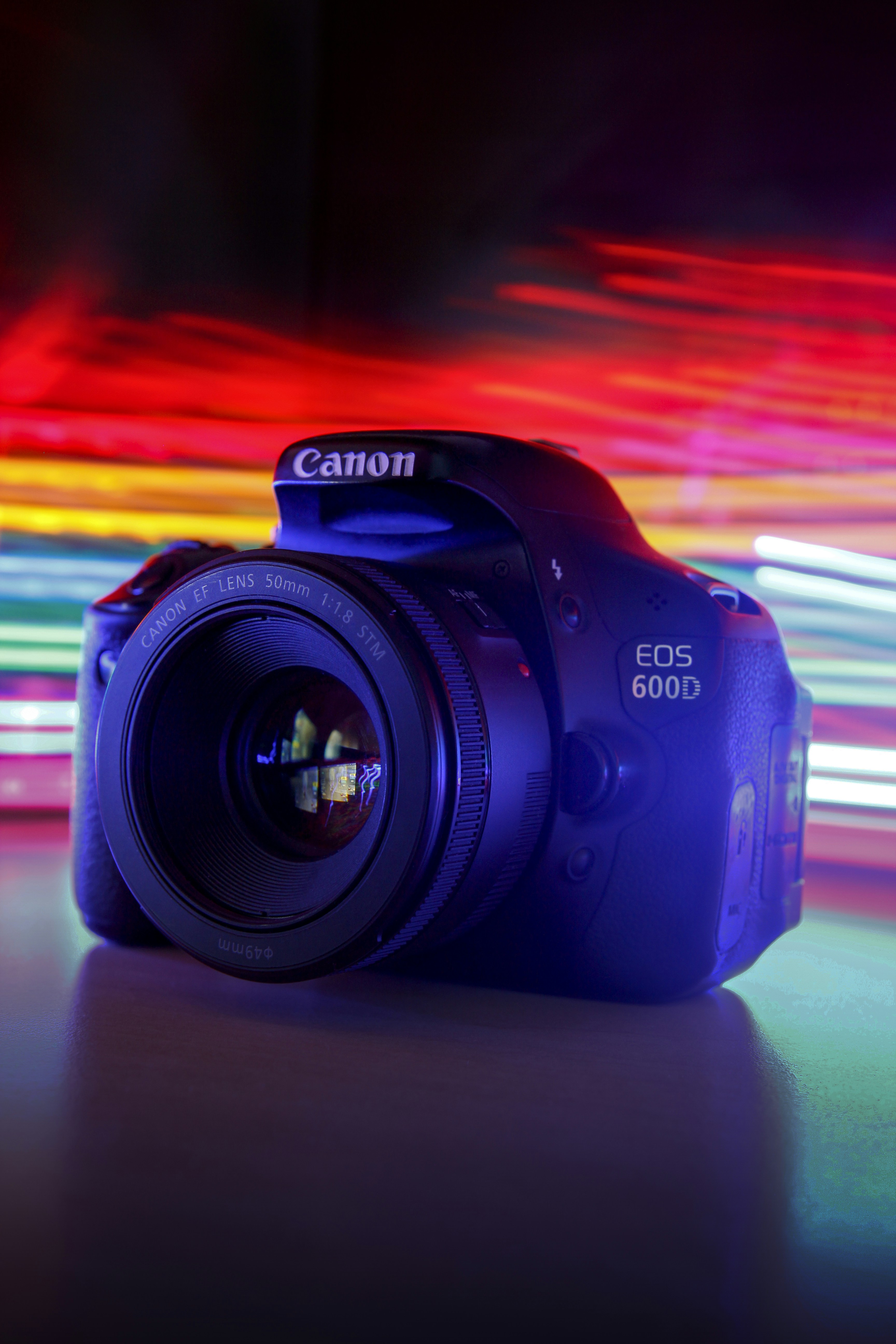 black nikon dslr camera on brown wooden table