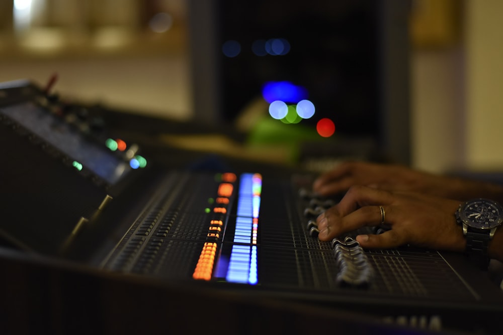 person playing black and white electric keyboard