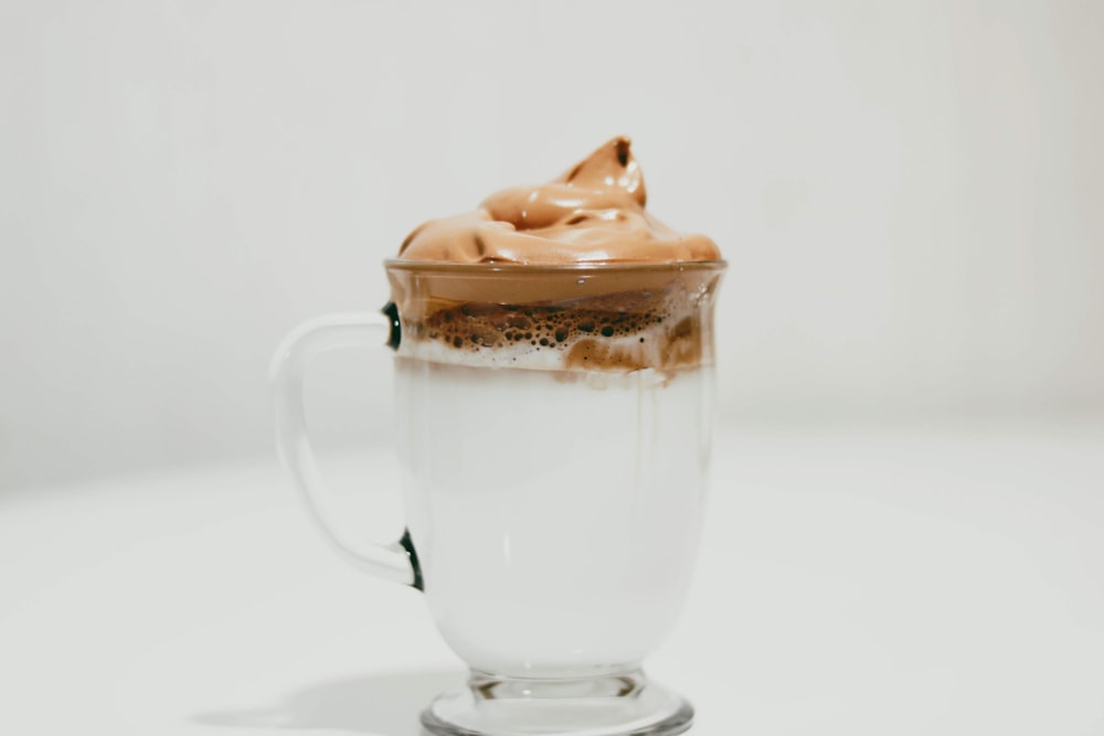 clear glass mug with ice cream