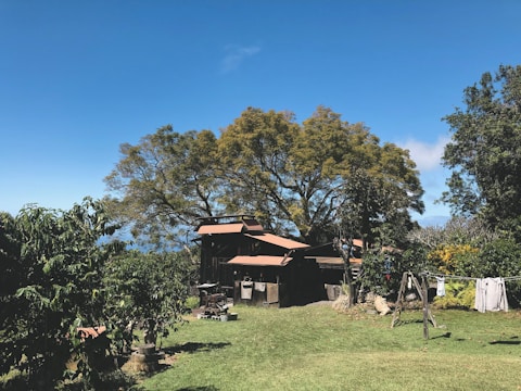 Cozy family house with a garden under a clear blue sky.