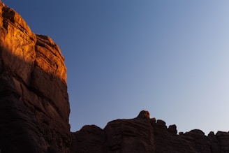 A dramatic shot of a national monument bathed in warm sunset light.