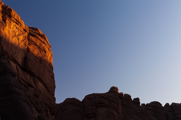 A dramatic shot of a national monument bathed in warm sunset light.