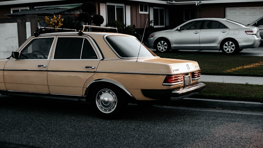 brown and white vintage car on road during daytime