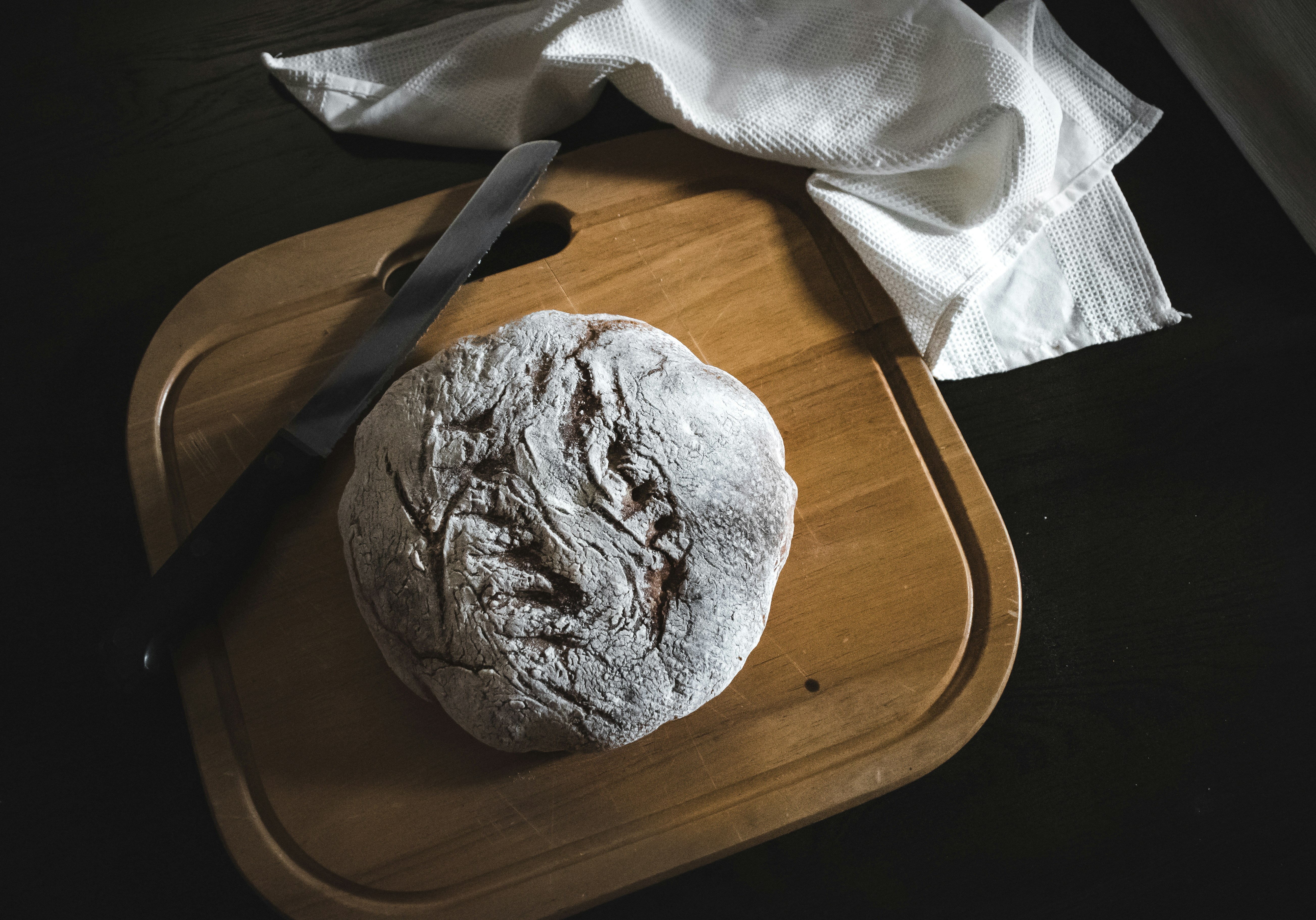 white textile on brown wooden table