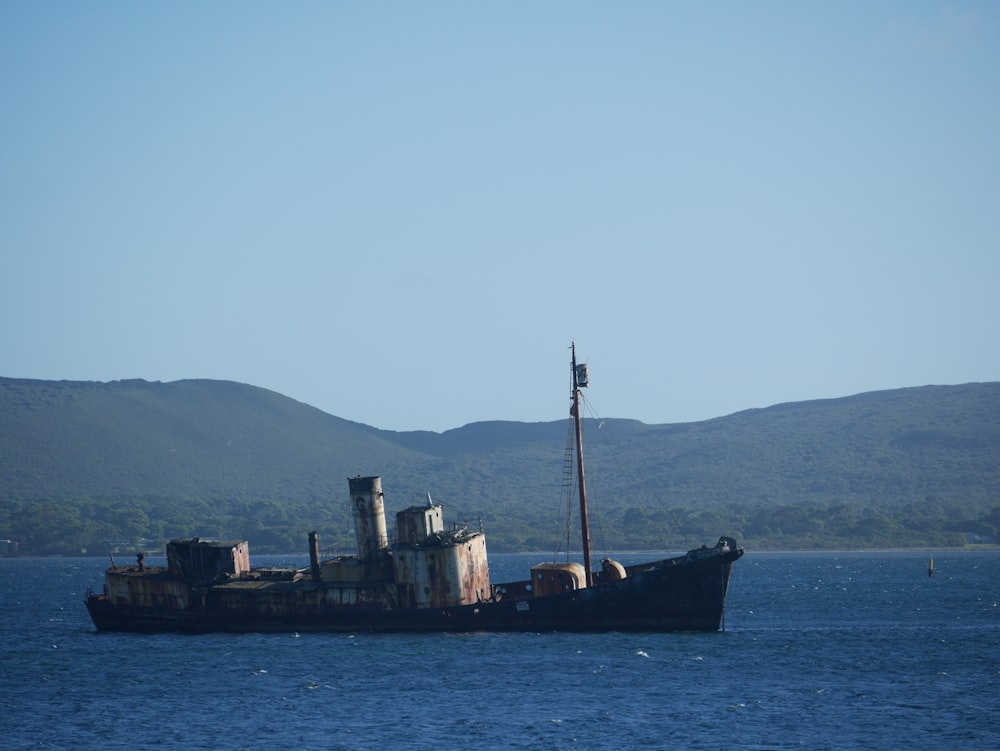 brown ship on sea during daytime