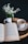 white and blue ceramic mug on brown wooden table