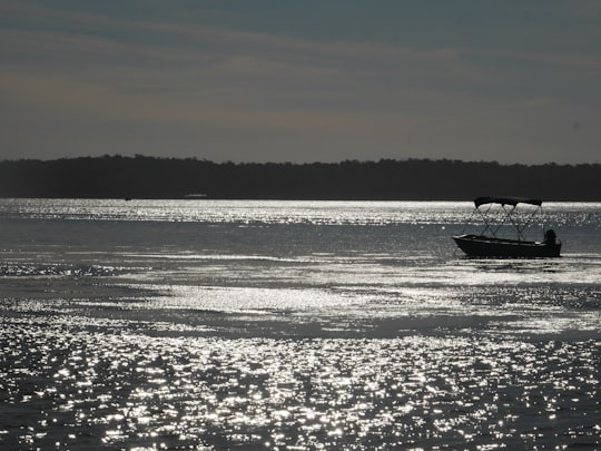 white boat on sea during sunset in Western Australia Australia