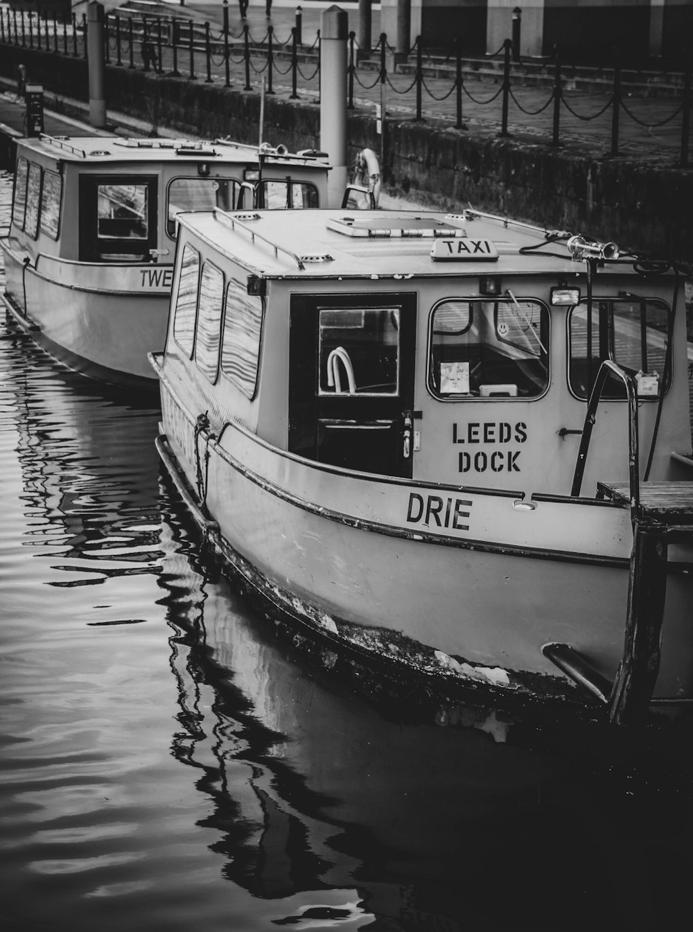 grayscale photo of boat on water