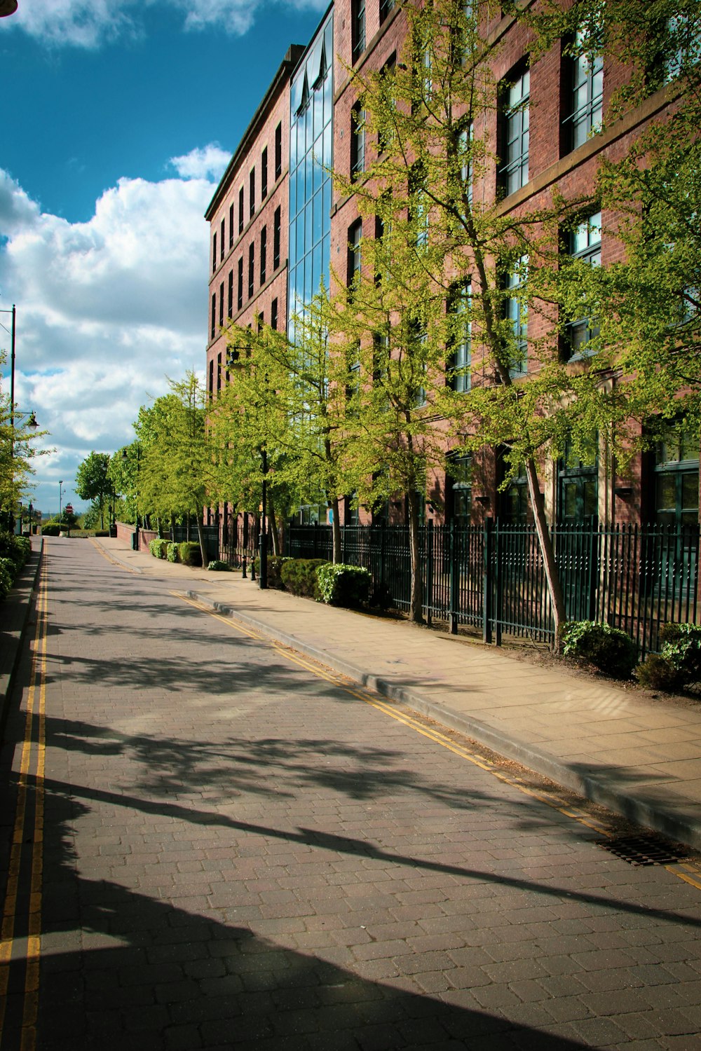 brown concrete building near green trees during daytime