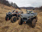 black and gray atv on brown field during daytime
