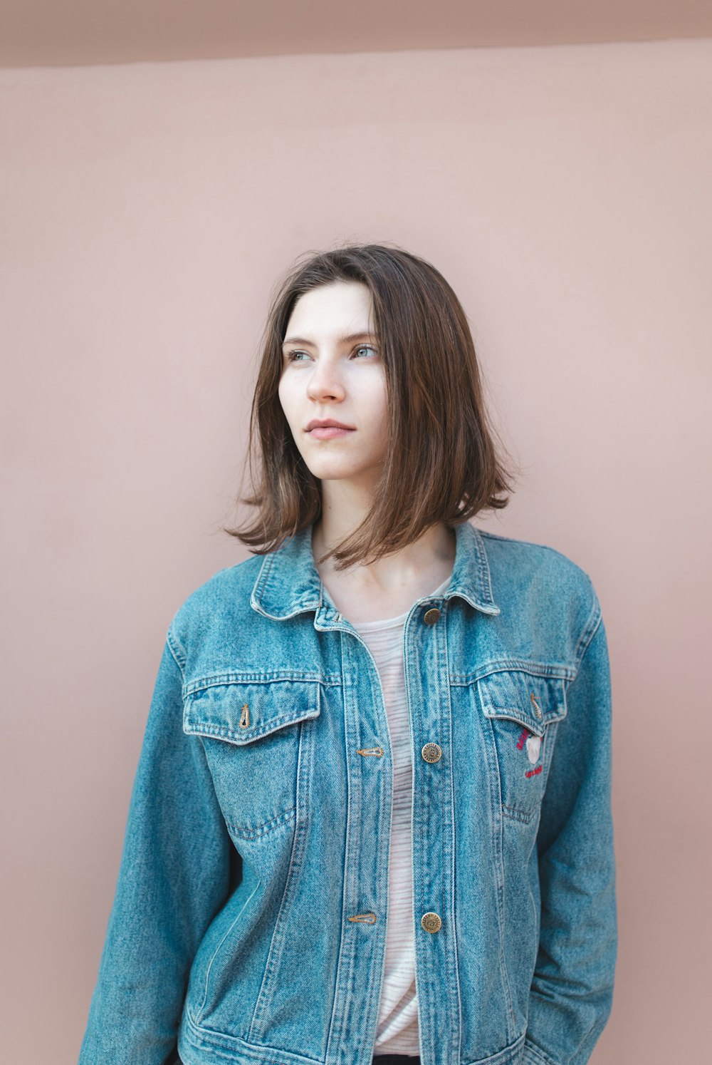 woman in blue denim button up jacket