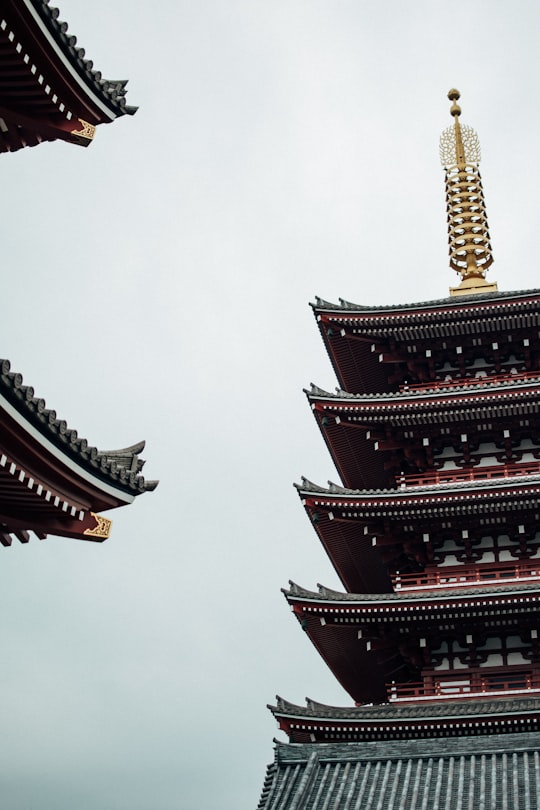 gold and red tower under white sky in Sensō-ji Japan