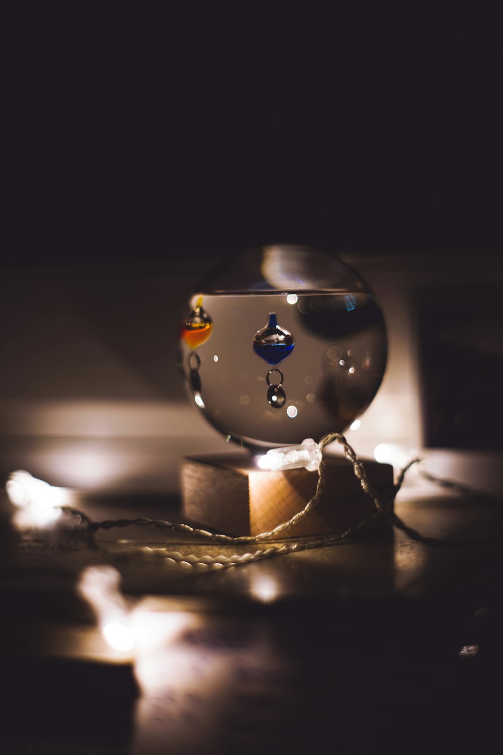 gold and silver ball on brown wooden table