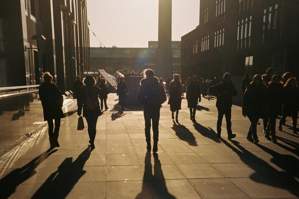 people walking on sidewalk during daytime