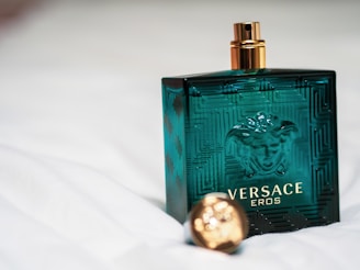 green and gold perfume bottle