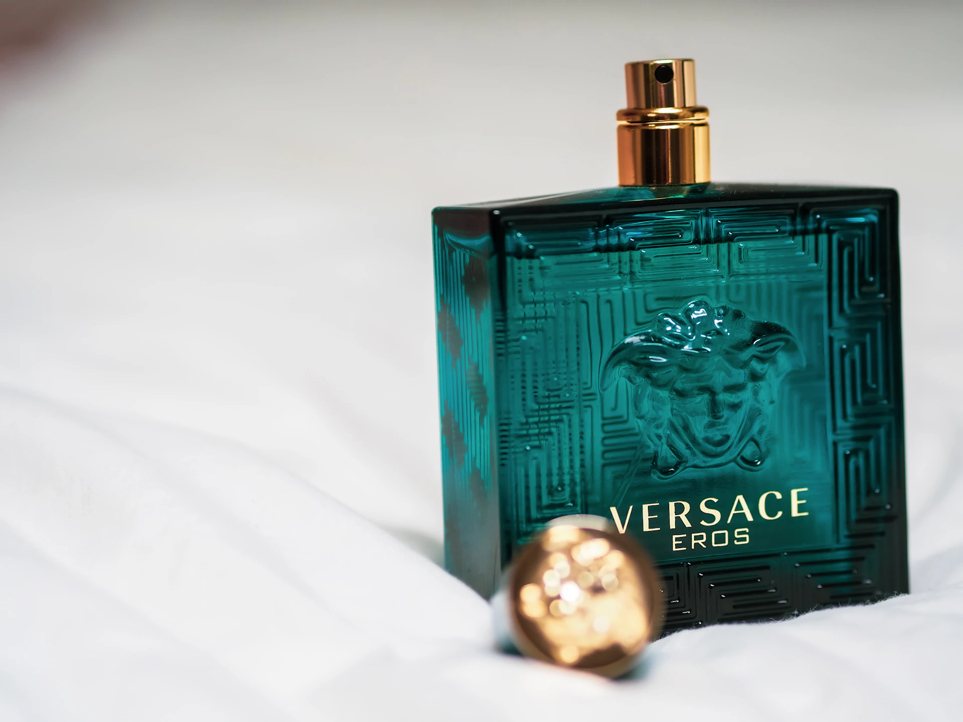 green and gold perfume bottle