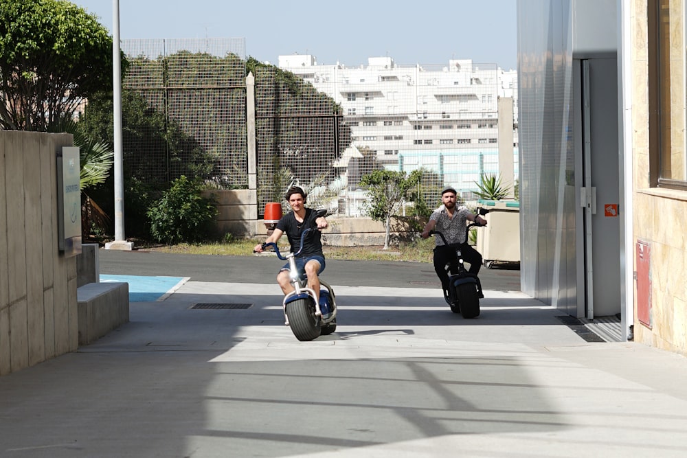 man in black jacket riding on bicycle during daytime