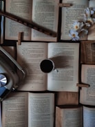 A peaceful studio corner with a piano, open books, and a cup of tea.