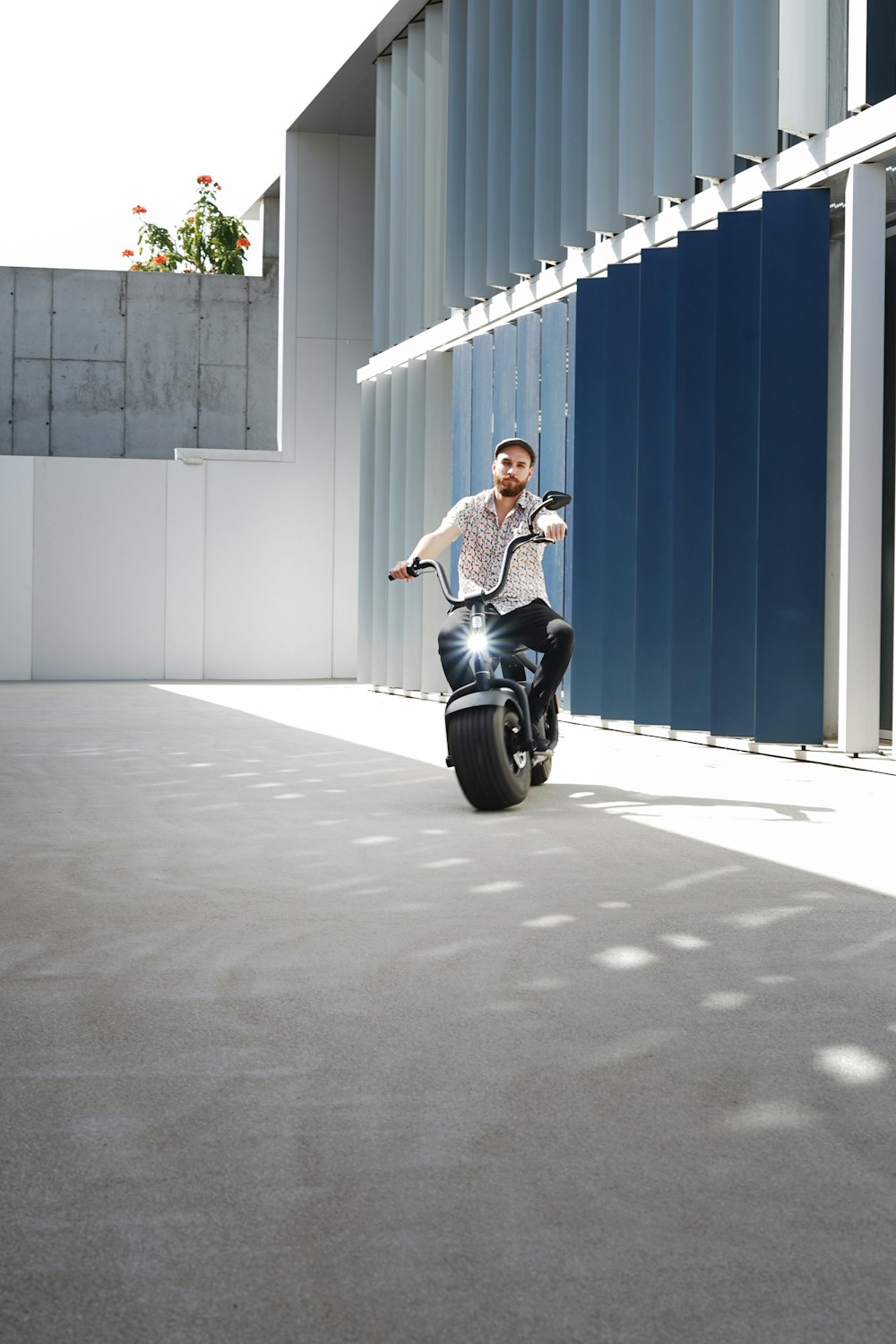 man in black t-shirt and black pants riding on black motorcycle