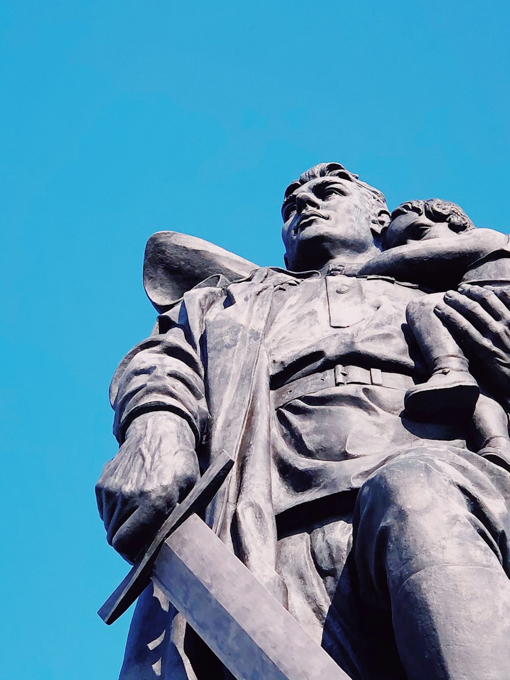 low angle photography of statue of man