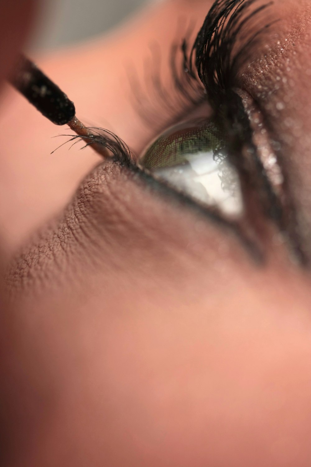 persons eye with black hair tie