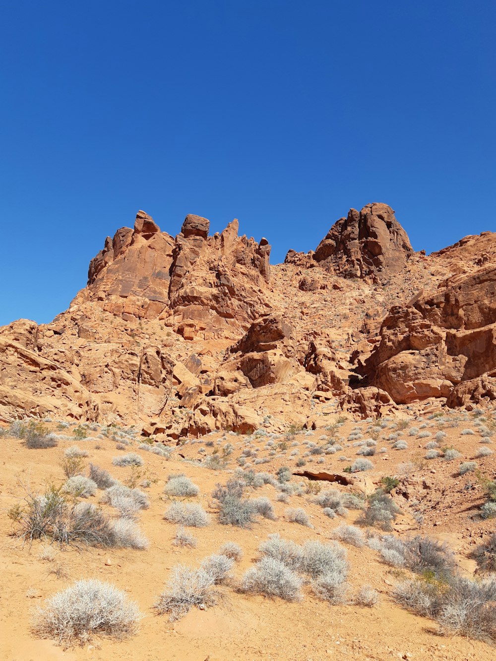 brown rock formation under blue sky during daytime