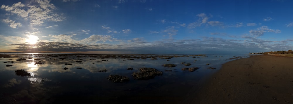 body of water under blue sky during daytime